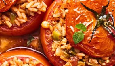 Stuffed tomatoes are a hearty and flavorful dish